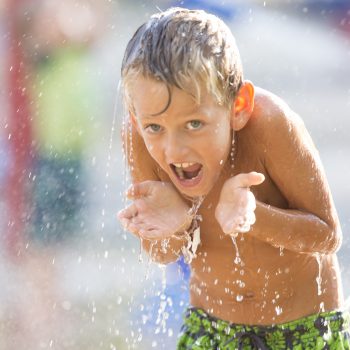 A kid having fun at the water park