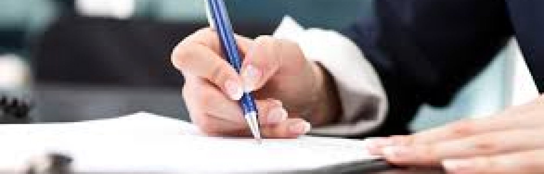 person writing on a notepad