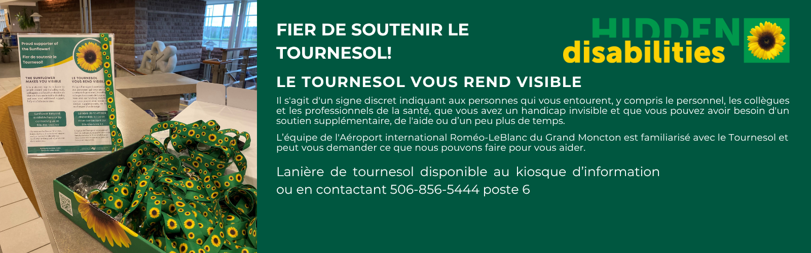 A display board in a green and yellow color scheme promoting the sunflower lanyard as a discreet symbol for hidden disabilities, with a box of green lanyards patterned with sunflowers in the foreground.